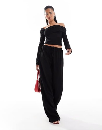 exclusive ribbed asymmetric off shoulder long sve top and trouser co-ord in black